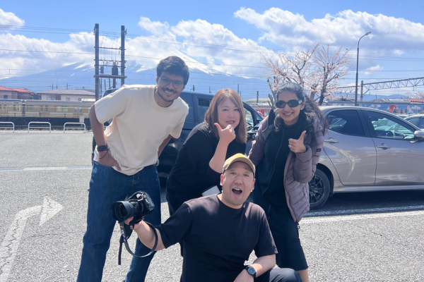 Smiling group photo with guests at the end of a Mt. Fuji photo tour, celebrating a joyful day together.