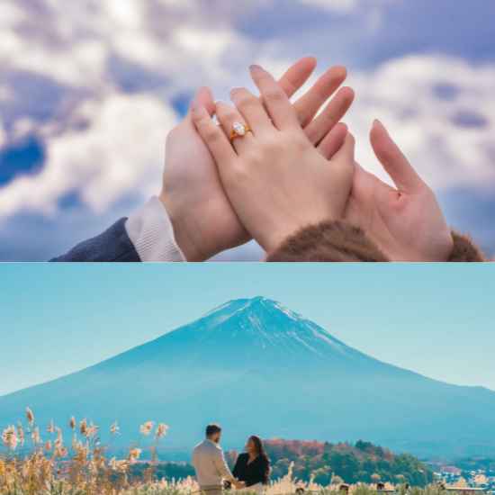 A romantic close-up of a couple holding hands with a gleaming engagement ring, set against a majestic view of Mt. Fuji.