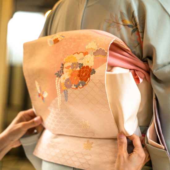 A close-up view of a beautifully tied traditional Japanese kimono obi sash.