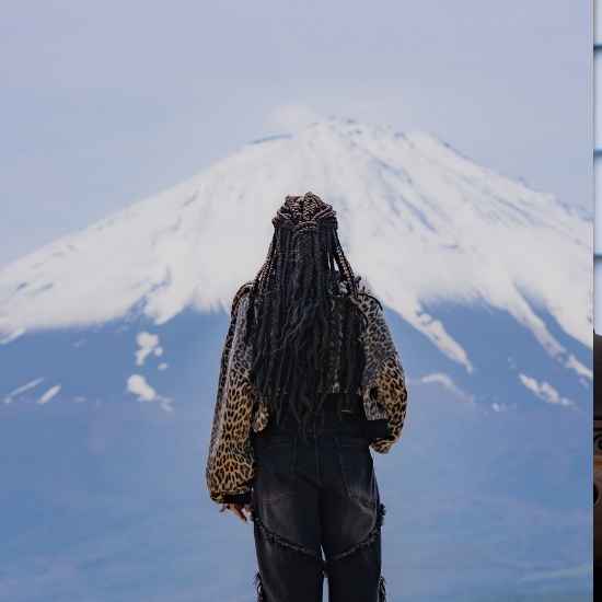 Back view of a stylish guest admiring the majestic Mt. Fuji from Narusawa Ikiiki Hiroba.