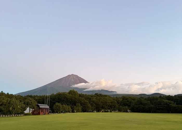 Wide-angle view of Mt. Fuji from the open grass field at Narusawa Ikiiki Square